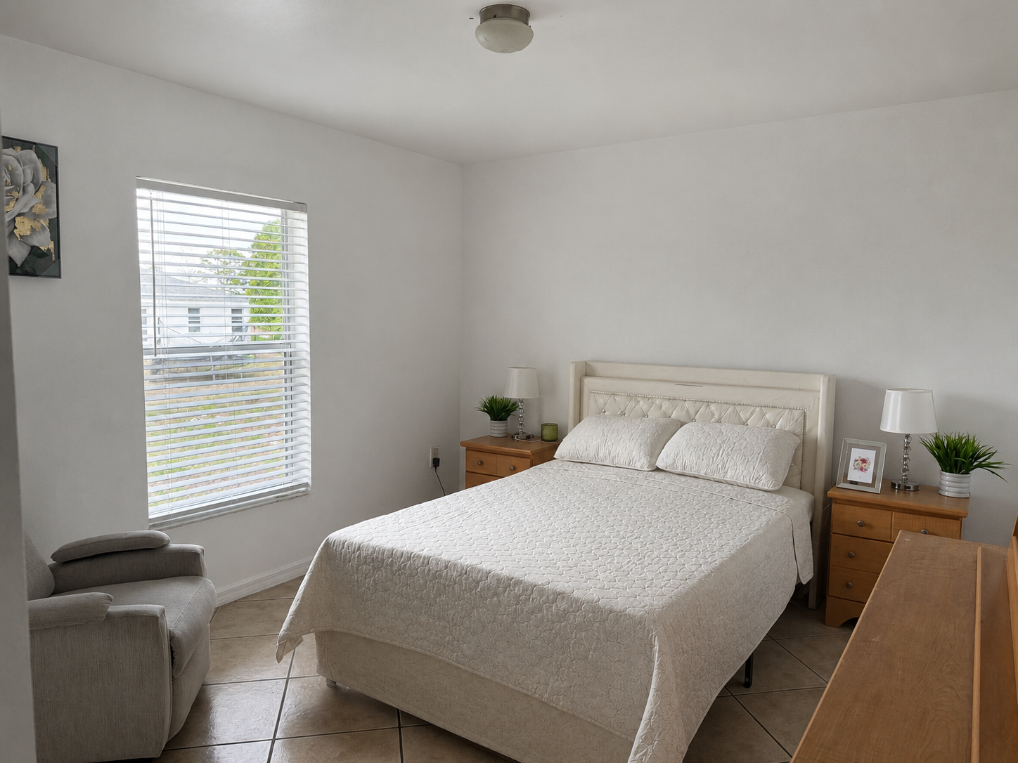 A caregiver spending time with a resident in a bright, home-like setting